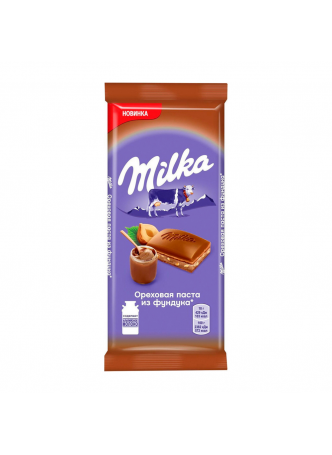 Шоколад молочный Milka с добавлением ореховой пасты из фундука и дробленым фундуком, 85г оптом